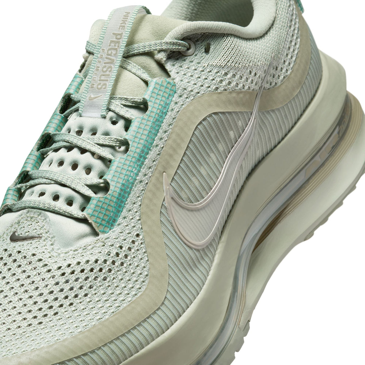 Nike men’s Pegasus Premium sneakers in Jade Horizon green, side view.