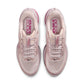 Nike Women's Pegasus Premium Silt Red running shoes with white Nike swoosh and supportive sole, outdoor setting.