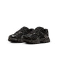 Black Nike Women's V5 RNR footwear with sleek design, shown in a close-up image highlighting the stylish sneaker details.