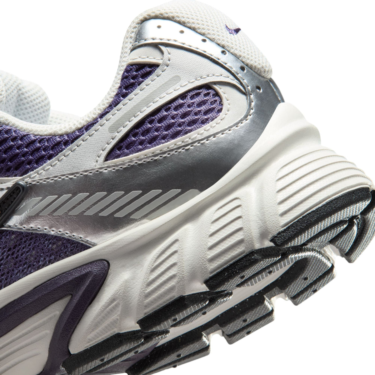 Nike women's V5 RNR sneakers in Dark Raisin, side view.
