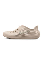 Nike Men's ReactX Rejuven8 Orewood footwear in side profile, white and tan design
