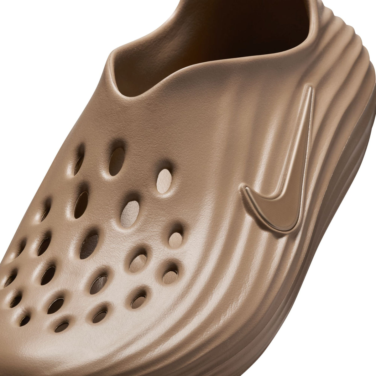 Nike men's ReactX Rejuven8 footwear in khaki, side view showing slip-on design and textured sole