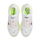 Nike men's Vomero Plus sneakers in white and Barely Volt, side view.