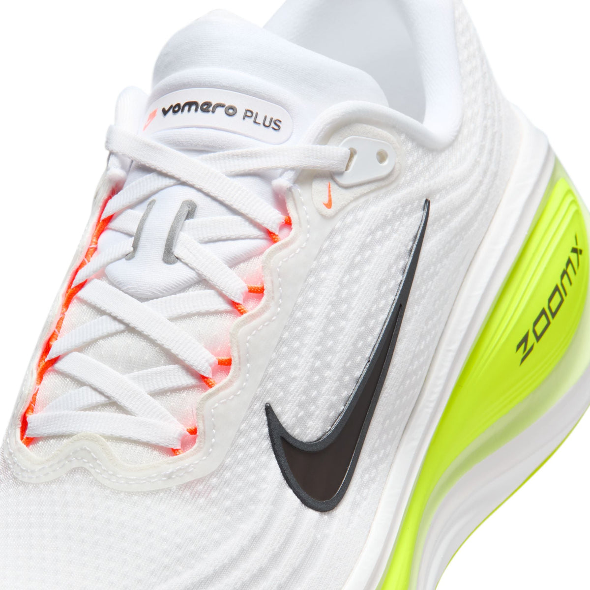 Nike men's Vomero Plus shoes in white with Barely Volt accents, side view.