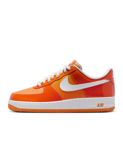 Nike men's Air Force 1 '07 LV8 sneakers in Safety Orange, side view aviator-style footwear.