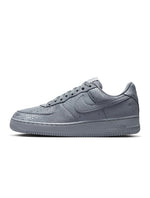 Nike men's Kobe Air Force 1 Low sneakers in Wolf Grey, featuring a sleek low-top design and Nike branding.