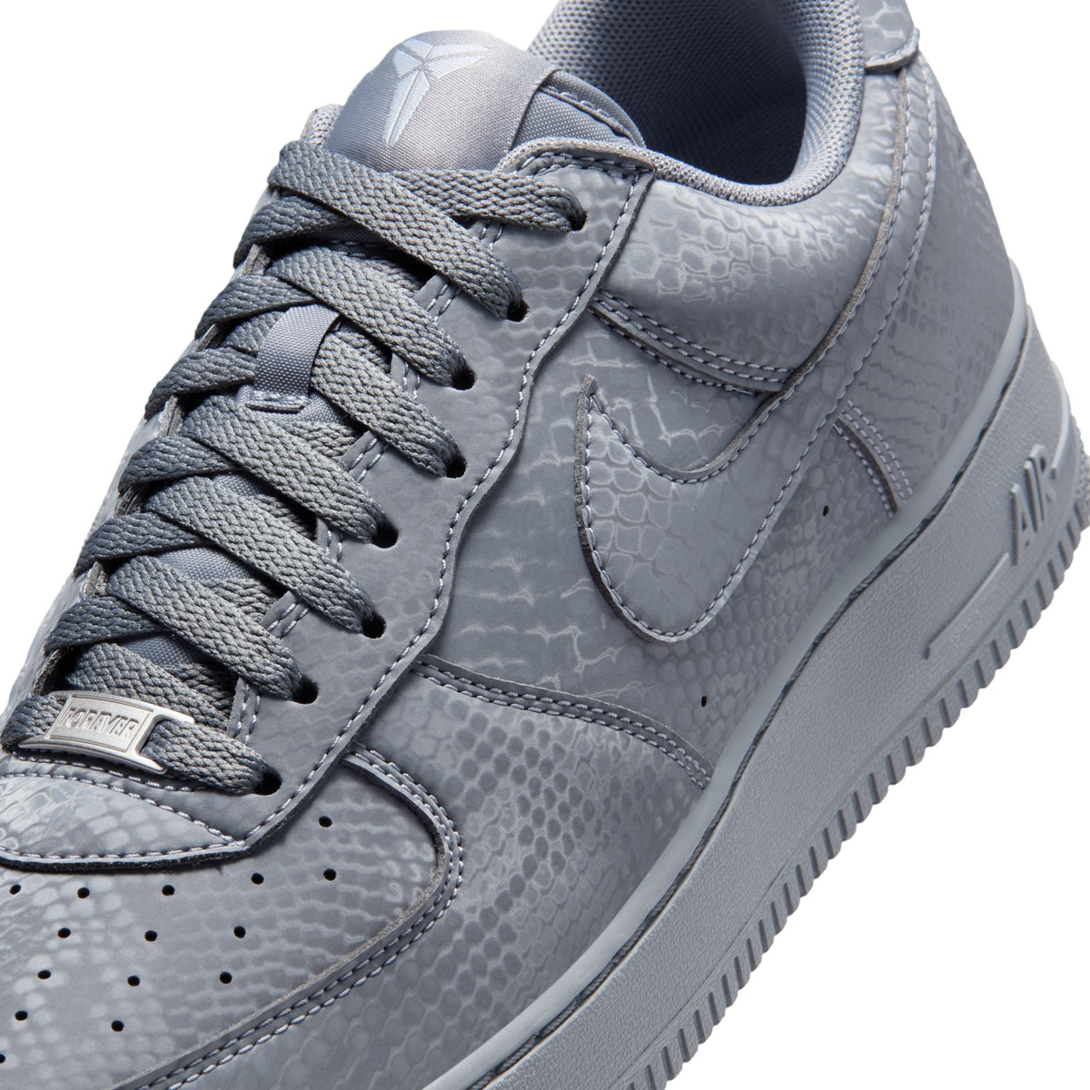 Nike men's Kobe Air Force 1 Low sneakers in Wolf Grey, shown in a close-up of the stylish men's footwear.