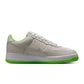 Nike men's Kobe Air Force 1 Low sneakers in vibrant electric green, featuring a sleek design and classic low-top style.