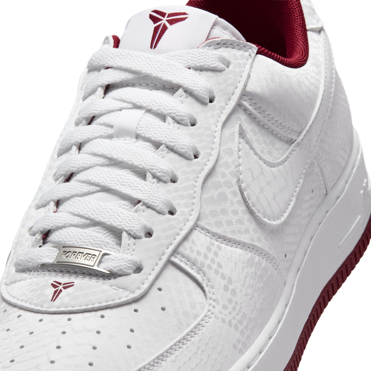 Nike men's Kobe Air Force 1 Low sneakers in white and team red, featuring a sleek design and classic low-top style.