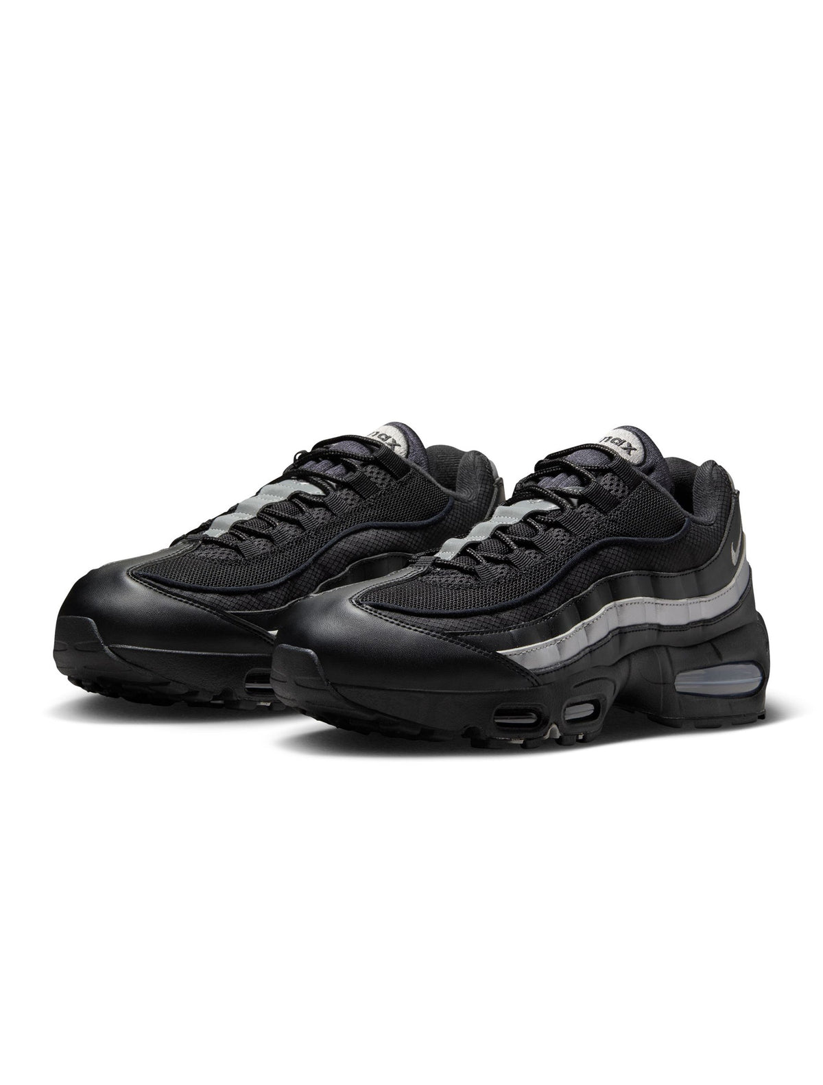 Nike men's Air Max 95 "Big Bubble" sneakers in black and metallic silver featuring layered design and visible Air Max units.