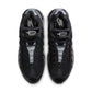 Nike Air Max 95 men's footwear in black with metallic silver accents, showcasing the iconic design and cushioning detail.