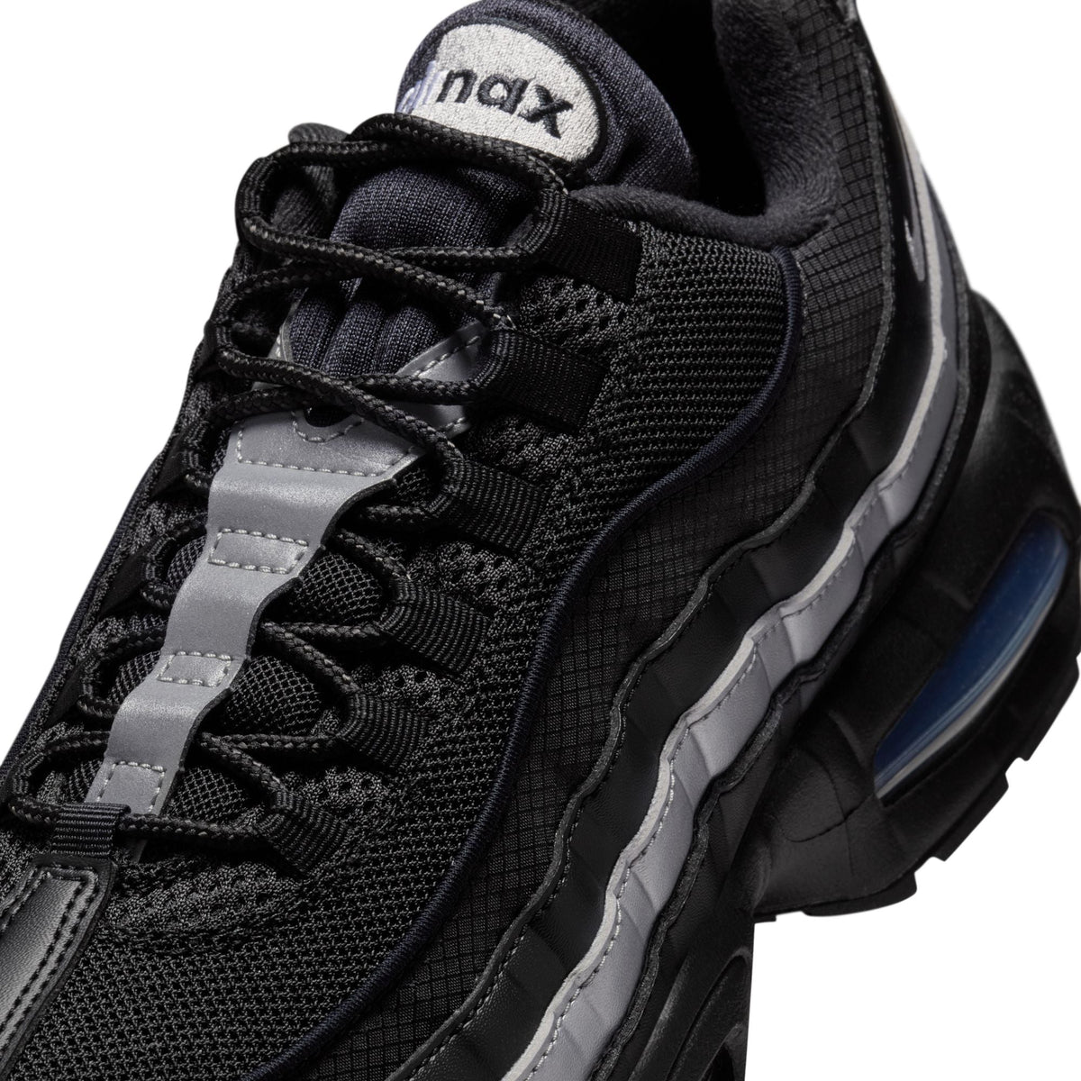 Nike Mens Air Max 95 Big Bubble black and metallic silver athletic sneakers showing side view with visible Air Max cushioning