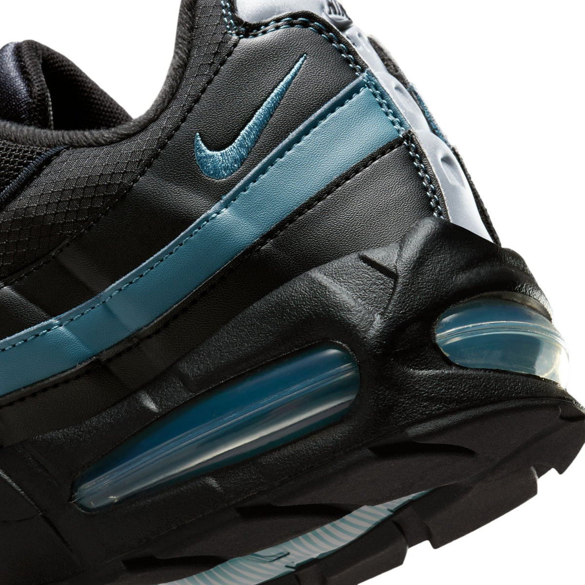 Nike men's Air Max 95 "Big Bubble" sneakers in black and smokey blue, featuring layered design and visible air cushioning.