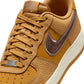 Nike men's Air Force 1 '07 Lv8 wheat and baroque brown sneakers, showcasing the stylish footwear design and color details.