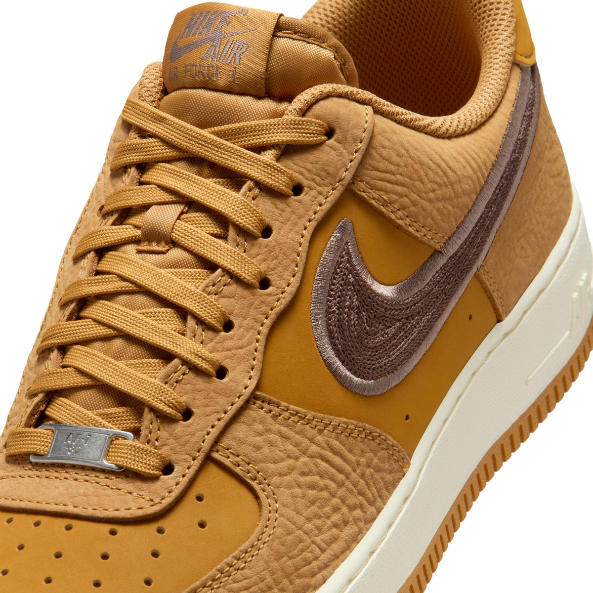 Nike men's Air Force 1 '07 Lv8 wheat and baroque brown sneakers, showcasing the stylish footwear design and color details.