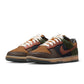 Nike Mens Dunk Low Retro Premium British Tan sneakers in brown leather, featuring classic design and Nike branding.
