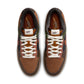 Nike Mens Dunk Low Retro Premium British Tan sneakers in tan and white leather, displayed on a neutral background.