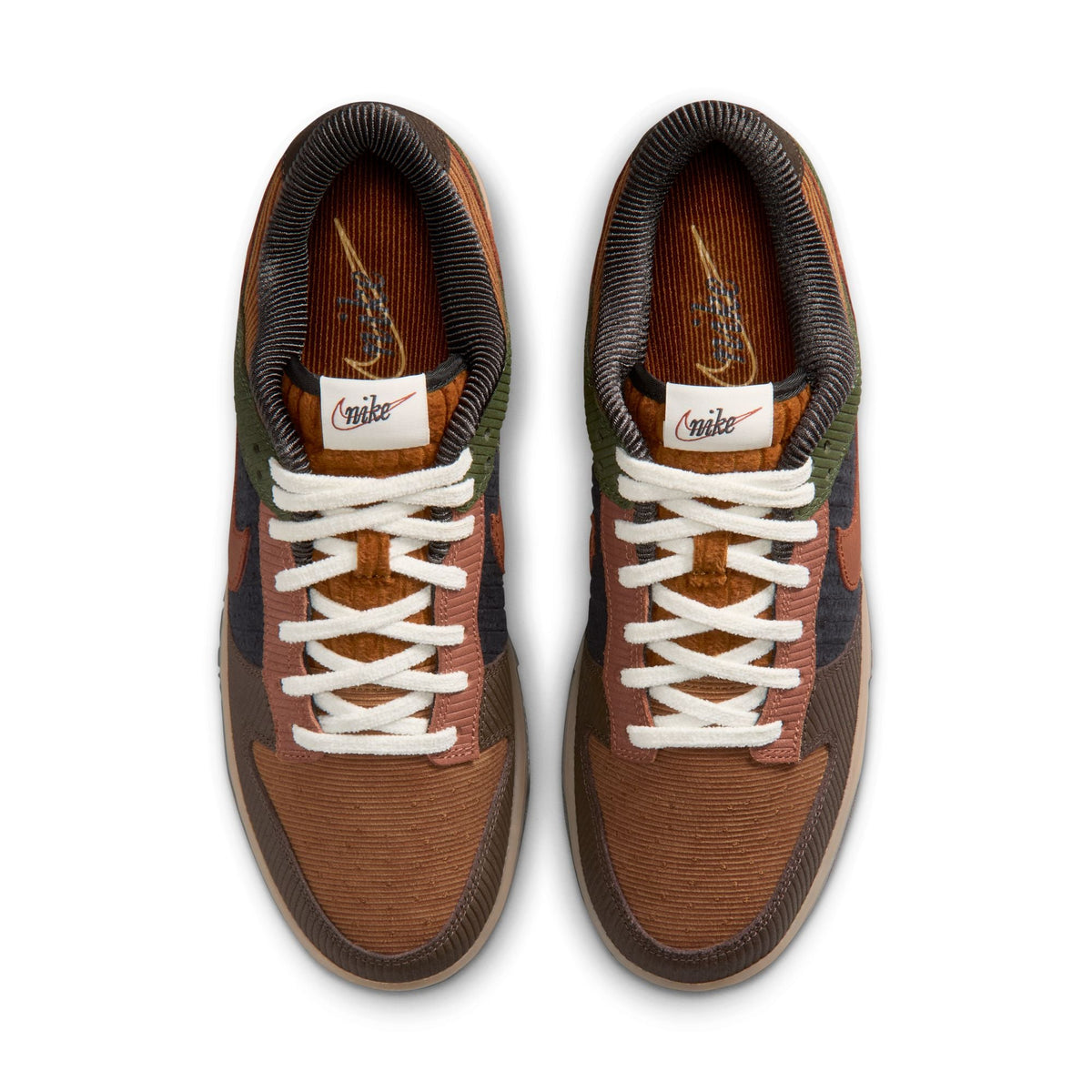 Nike Mens Dunk Low Retro Premium British Tan sneakers in tan and white leather, displayed on a neutral background.