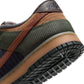 Nike men's Dunk Low Retro Premium sneakers in British Tan with tan and brown leather, featuring Nike branding and stylish design.