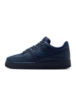 Men's Nike Air Force 1 '07 sneakers in Obsidian color, featuring a classic design with blue leather upper and white sole.