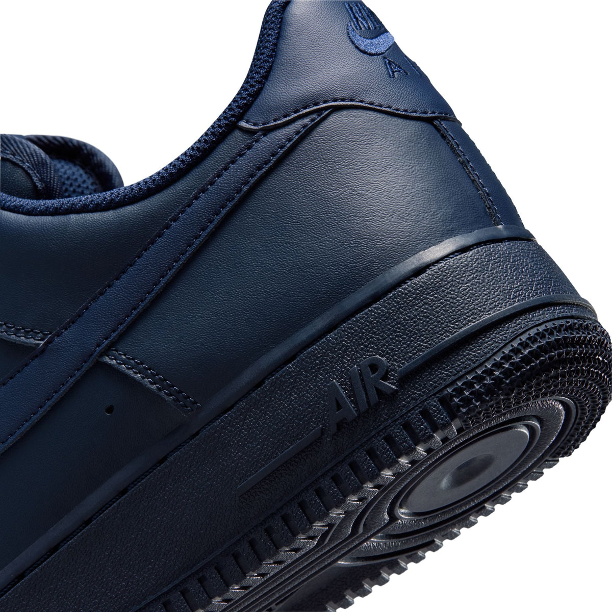 Men's Nike Air Force 1 '07 sneakers in Obsidian color, showcasing the classic design with white sole and navy-blue upper.