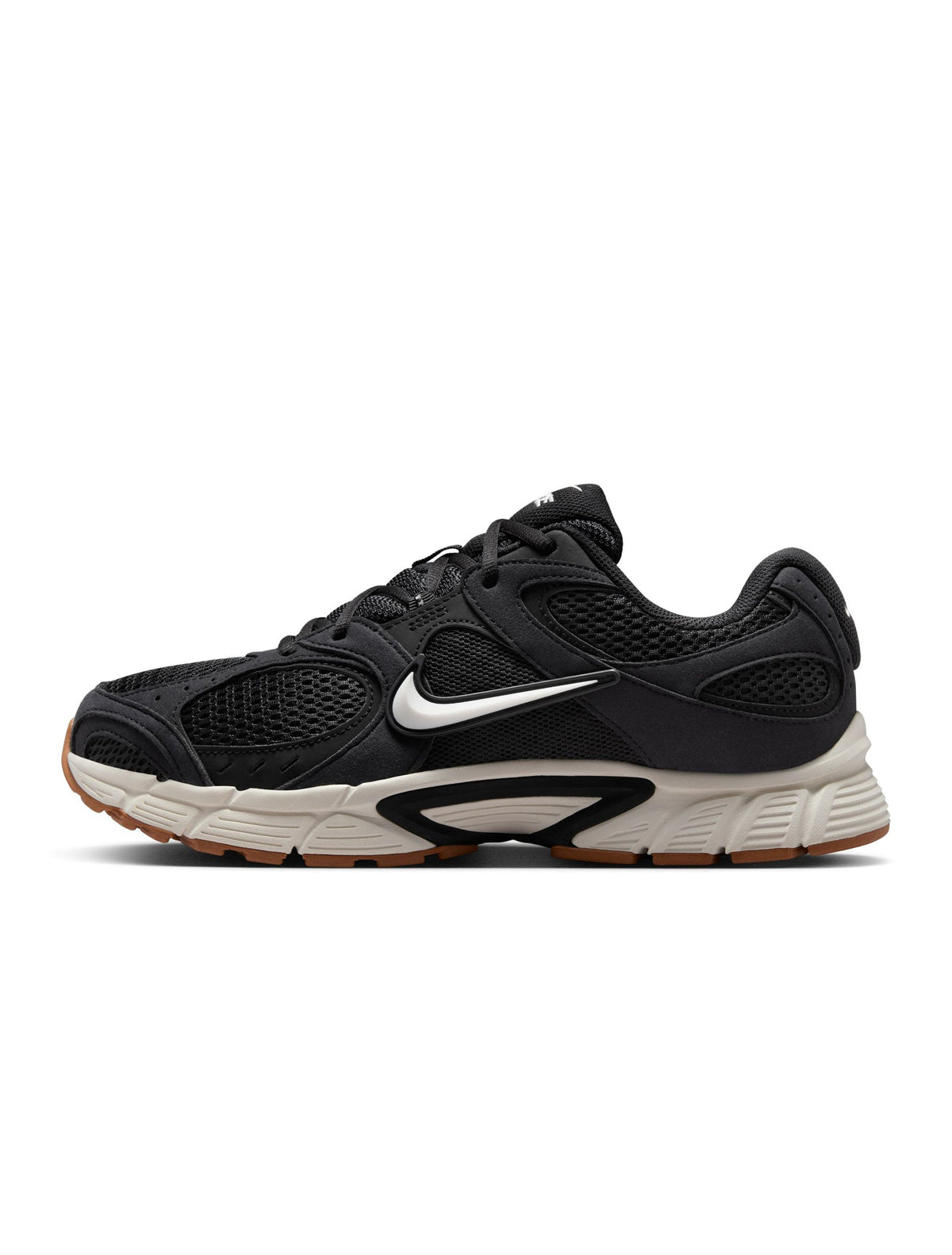 Nike men's V5 RNR black and gum color footwear, showcasing sleek design and comfortable fit in a natural outdoor setting.