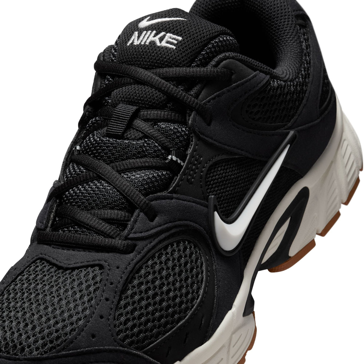 Nike men's V5 RNR footwear in black with gum soles, featuring a sleek design and stylish accents, perfect for casual wear.