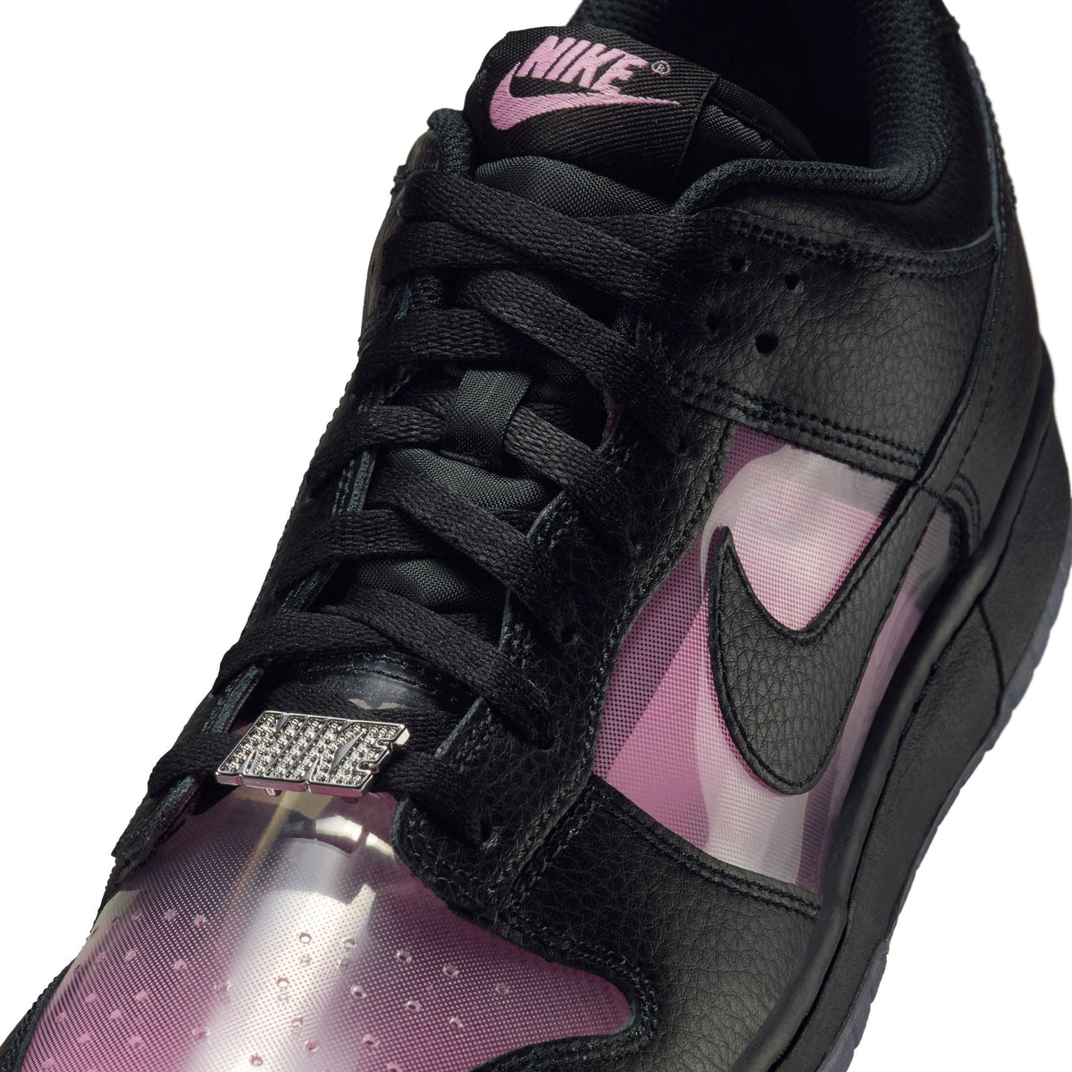 Nike Men's Dunk Low Retro Premium sneakers in pink rise with white accents, featuring a classic low-top design and stylish details.