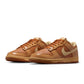 Nike Mens Dunk Low Retro Sesame sneakers in navy and tan leather, featuring classic low-top design and white midsole.