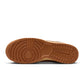 Nike Men's Dunk Low Retro Sesame sneakers featuring a tan and cream design, casual footwear with a classic low-top style.