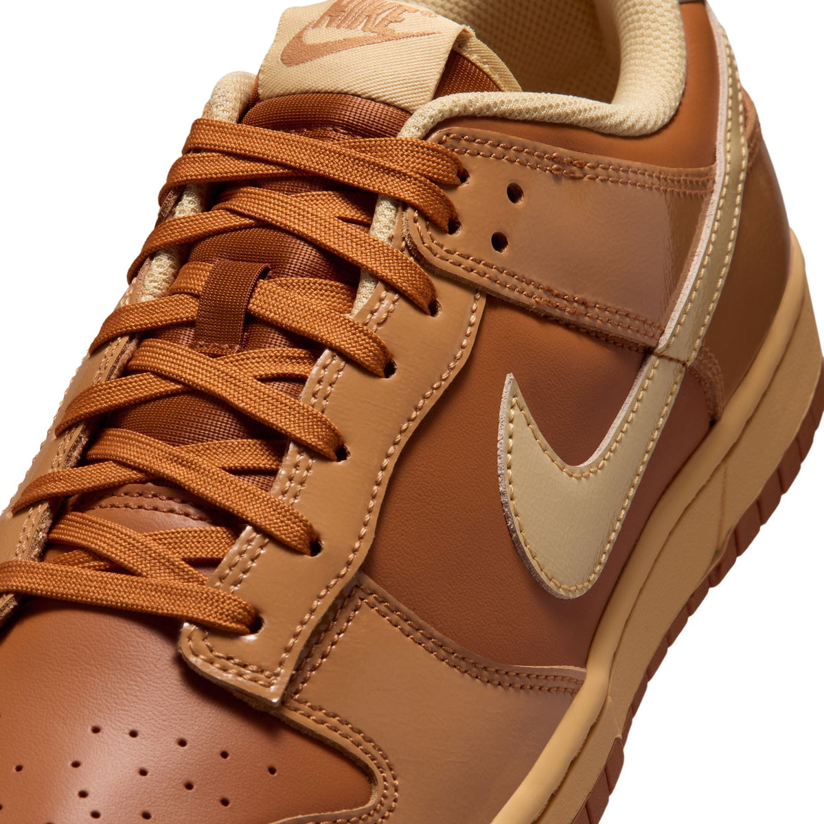 Nike Mens Dunk Low Retro Sesame sneakers, side view showcasing beige and brown colorway, classic low-top design and textured materials.