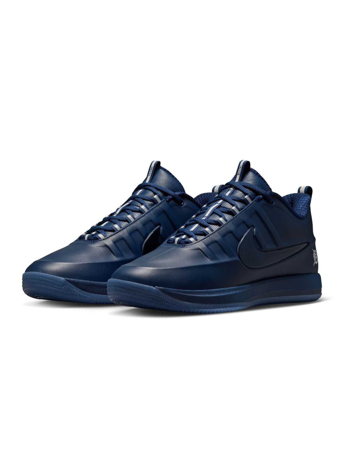Nike men's Book 2 Detroit Tigers sneakers featuring navy and orange colorway with sporty design and branding.