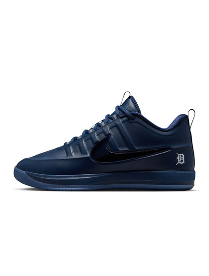 Nike men's Book 2 Detroit Tigers sneakers in navy and orange with mesh and leather details, displayed on a plain background.