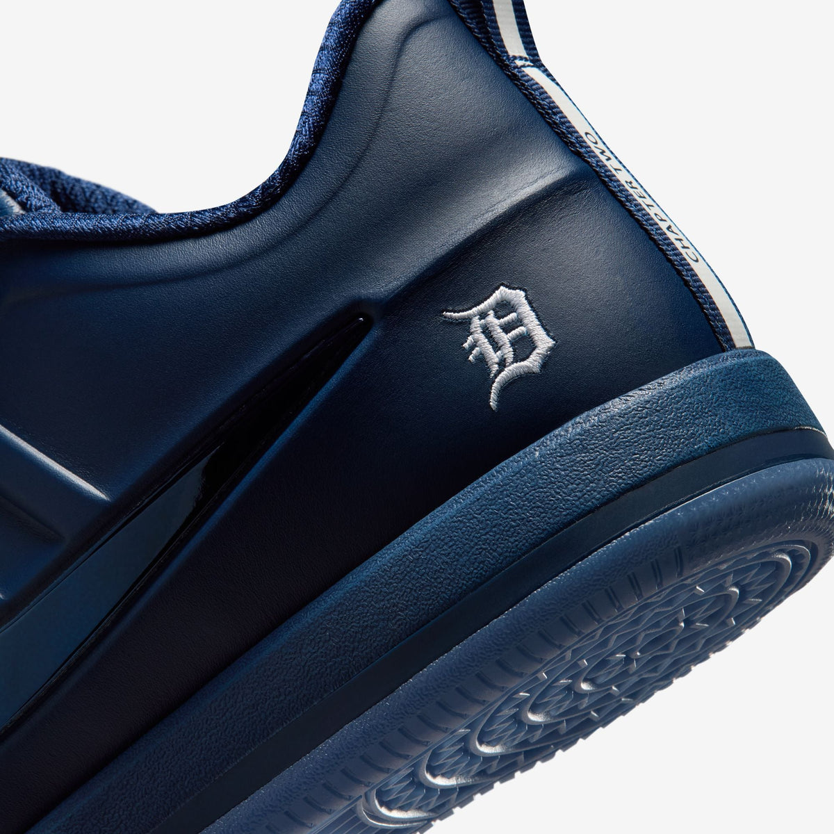 Nike men's Book 2 Detroit Tigers sneakers, denim-inspired footwear with Tigers branding, styled with blue and white accents.