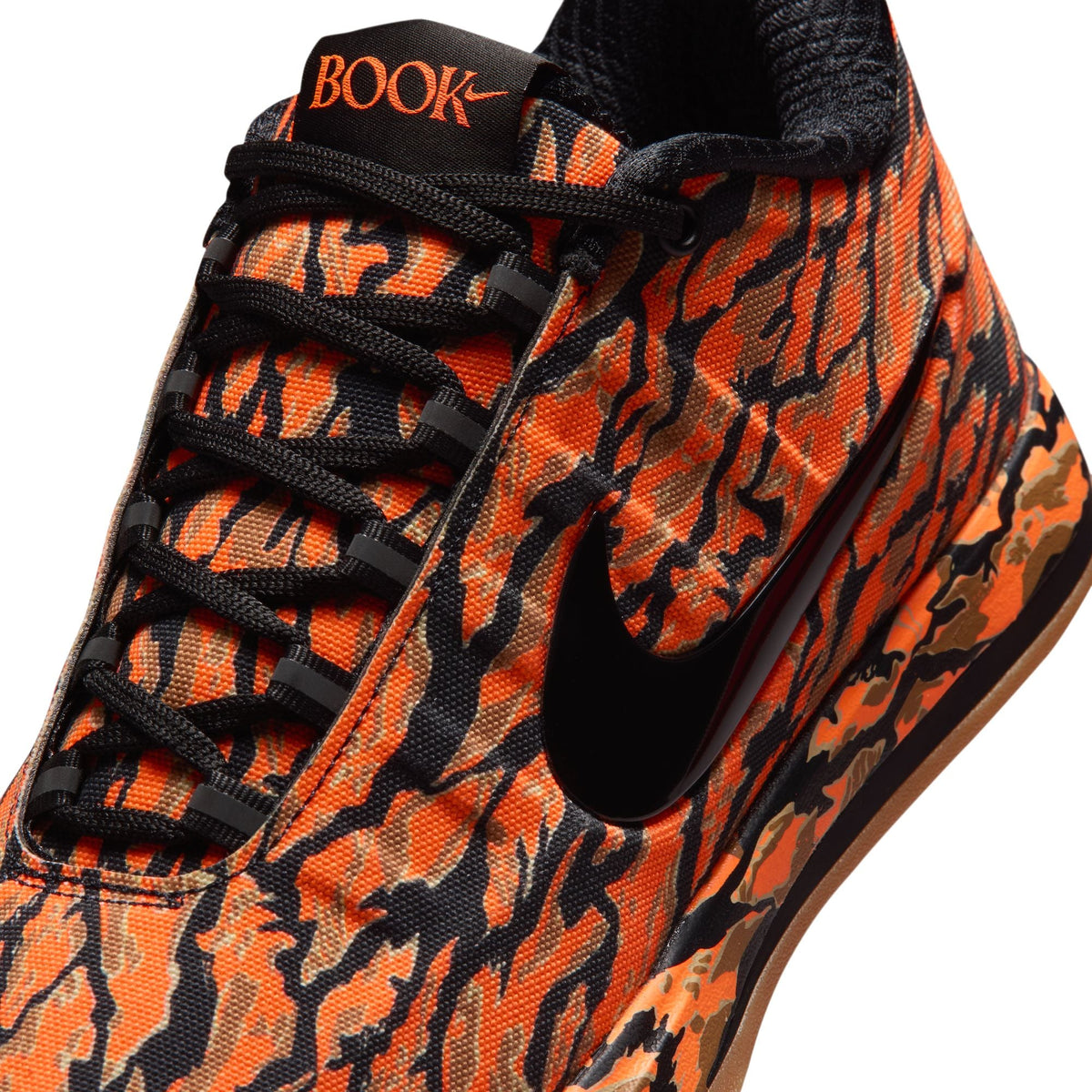 Nike Men's Book 2 Tiger Camo sneakers, denim exchange men's footwear with tiger camo pattern, front view showing design details.