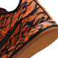 Nike men's Book 2 Tiger Camo sneakers showcasing camouflage pattern and sporty design, ideal for casual wear.