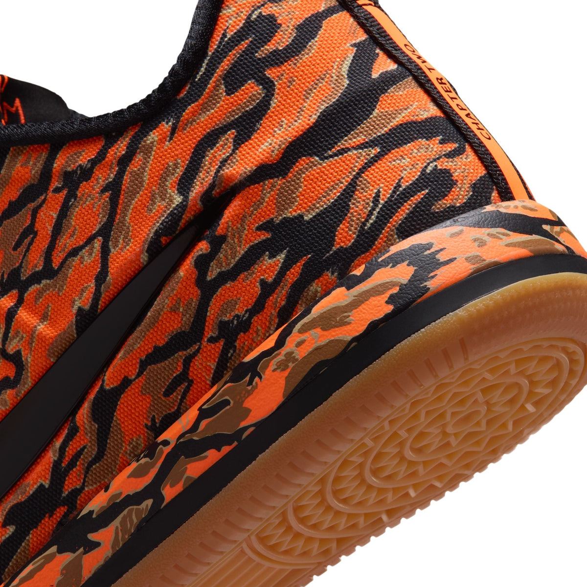 Nike men's Book 2 Tiger Camo sneakers showcasing camouflage pattern and sporty design, ideal for casual wear.