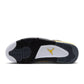 Men's Air Jordan 4 Retro Tour Yellow sneakers in a close-up view, showcasing the vibrant yellow color and classic design.