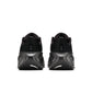 Black Nike Men's Vomero Plus sneakers, side view, with cushioned sole and streamlined athletic design