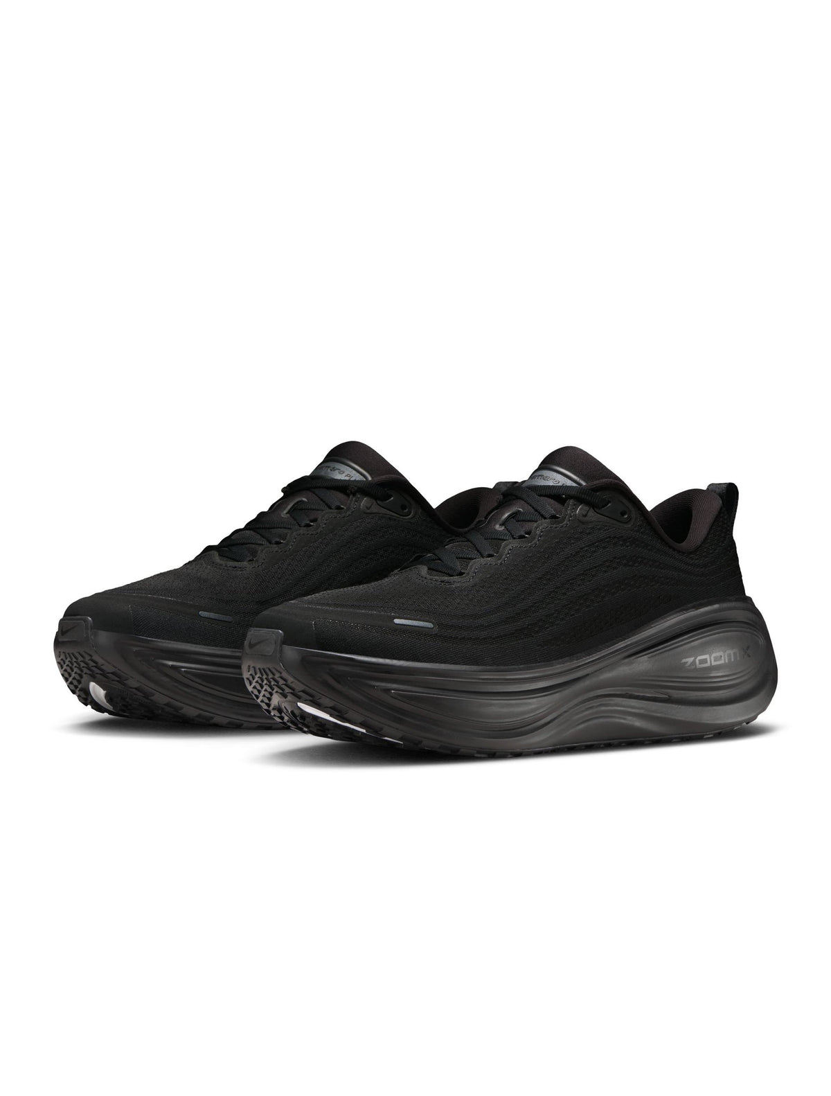 Black Nike men's Vomero Plus sneakers, side view.
