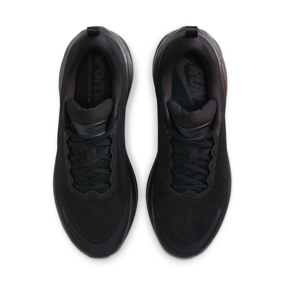 Black Nike Men's Vomero Plus sneakers, side view sneaker detail.
