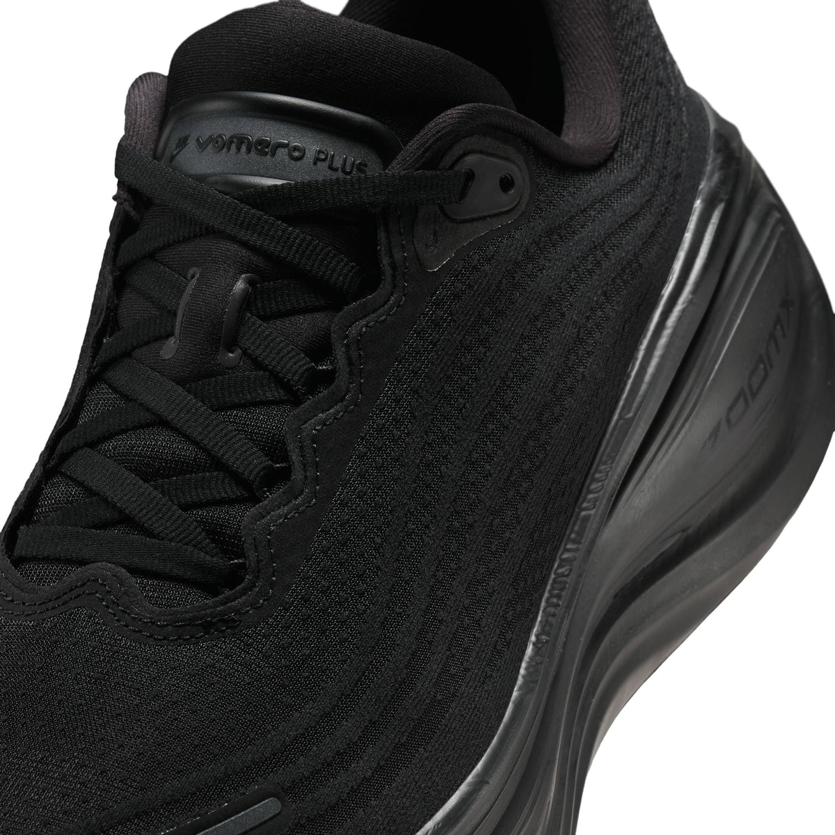 Black Nike Men's Vomero Plus footwear.