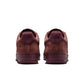 Nike men's Air Force 1 Low Retro Premium sneakers in Red Sepia; side view of low-top footwear