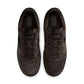Black Nike Air Force 1 Low Retro Premium men's footwear with white soles and classic design, shown from a side angle.