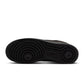Black Nike Air Force 1 Low Retro Premium men's sneakers with white soles and Nike swoosh, displayed on a white background.
