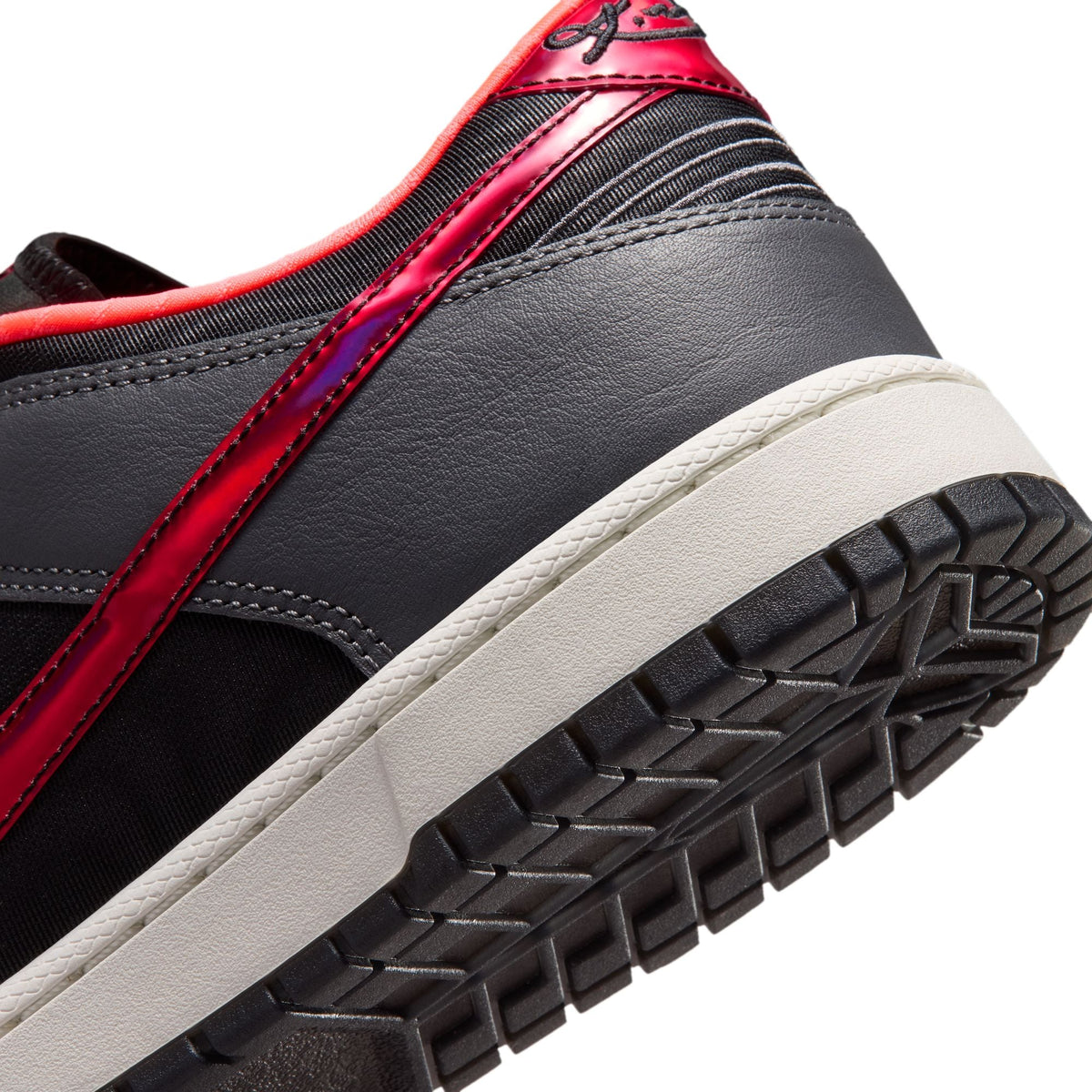 Nike men's Kobe Dunk Low Protro sneakers in black and hot punch with a stylish design, shown from a side angle.
