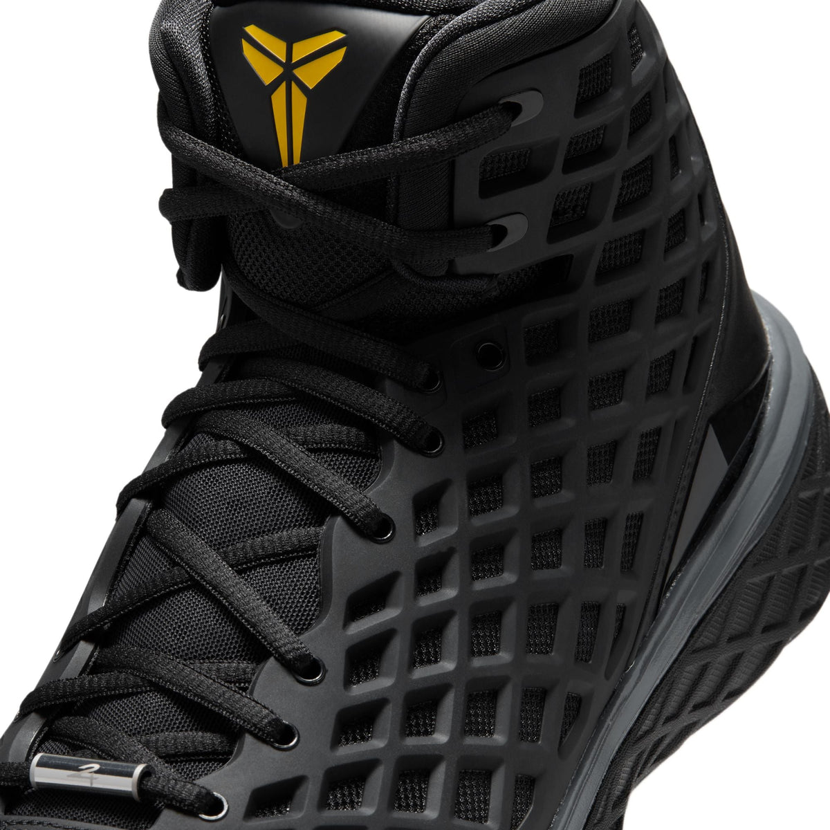 Nike Mens Kobe III Low Protro Orca sneakers in black and white with a sleek low-top design and Nike branding.