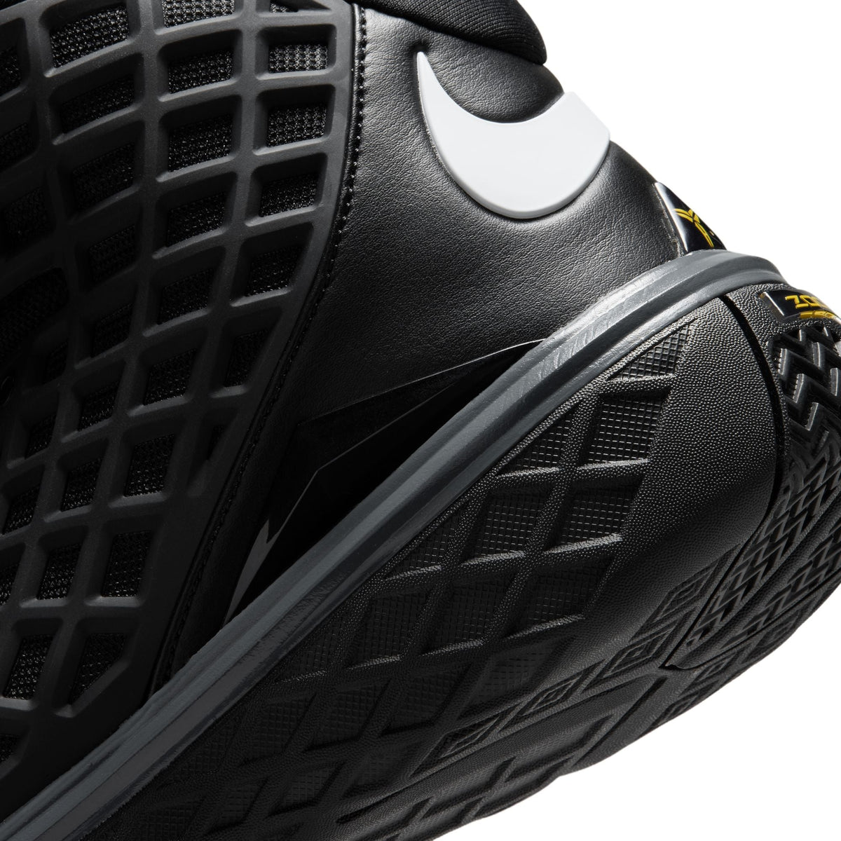 Nike Mens Kobe III Low Protro Orca basketball shoes in black and white with a sleek low-top design and Nike branding.