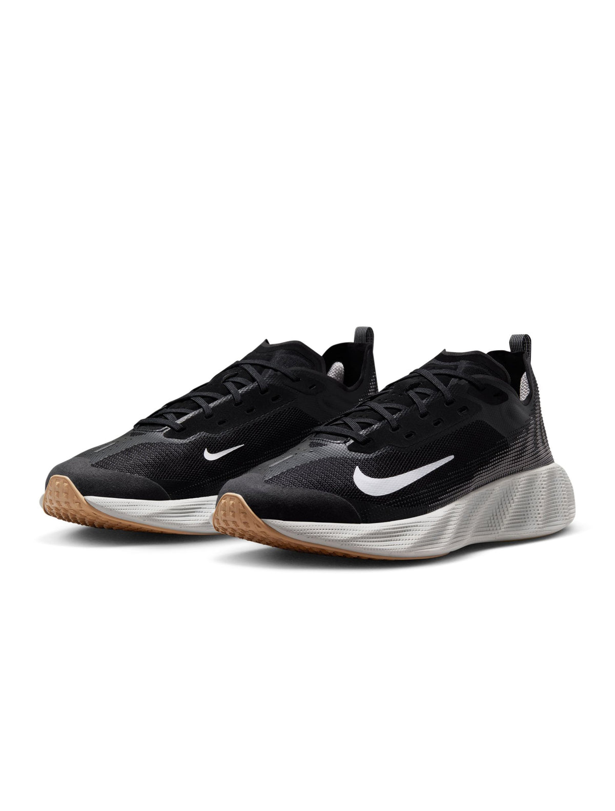 Black and white Nike men's Ava X Mesh footwear with breathable mesh design and stylish athletic look.