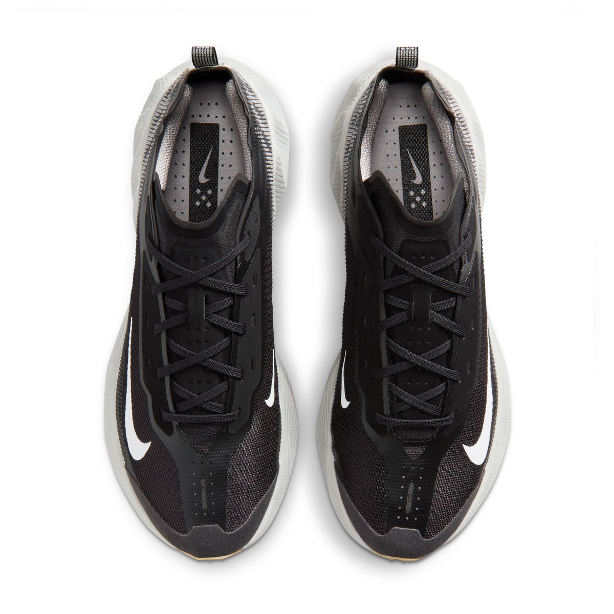 Black and white Nike men's Ava X Mesh footwear featuring breathable mesh material and stylish athletic design.